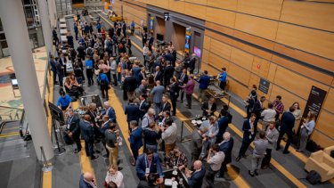 A large group of networking professionals at a summit